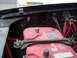 1989 Ford Bronco - The engine bay shows two Optima Red Top batteries secured with a metal bracket and wing nuts, along with red wiring and a toggle switch.