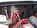1989 Ford Bronco - Close-up view of the engine bay wiring, showing a battery, solenoid, and ignition system components.