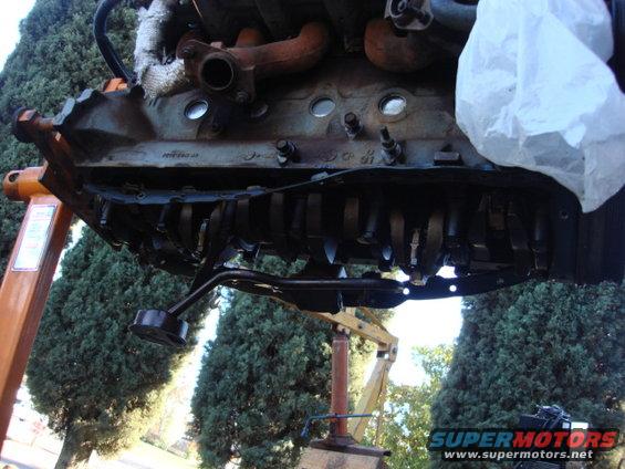 oil-pump.jpg after removing a few dozen bolts the oil pan and pan rails were off. the gasket was beat bad----it was way over tighened.