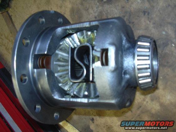 Differential carrier assembly with internal gears and bearing race
