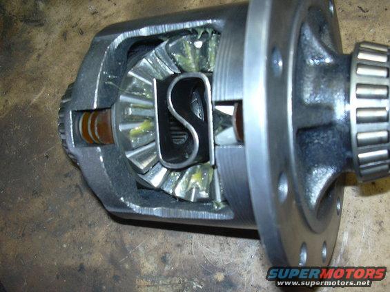 close-up of a differential carrier with gears and grease, bearing on the right