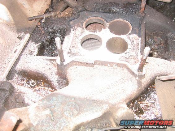 Close-up of an engine intake manifold with four circular openings. Text reads 'FIRING ORDER' and '126875'