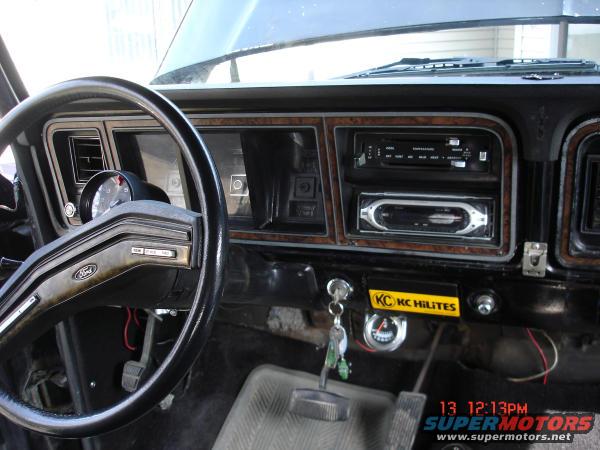1979 Ford Bronco interior showing steering wheel, dashboard, radio, and KC HiLiTES sticker