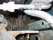 1994 Ford Bronco - Detail shot of corroded metal components and hoses, likely from the undercarriage of a vehicle.