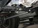 1994 Ford Bronco - Custom suspension brackets and shock absorber visible on the underside of a vehicle.