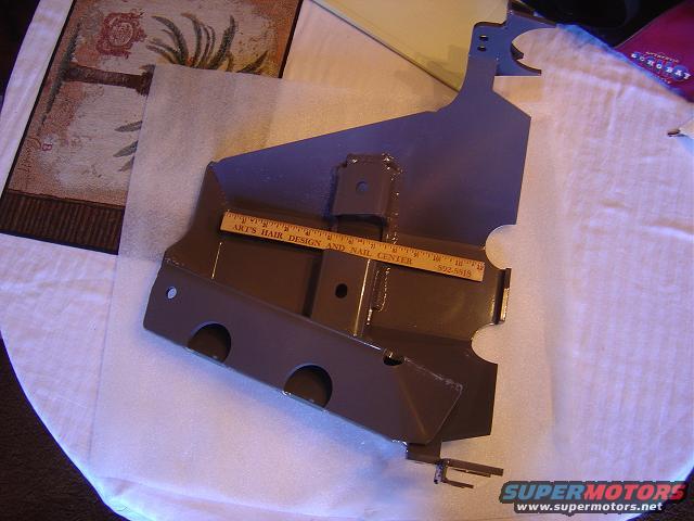 Brown metal bracket with ruler and text 'ART'S HAIR DESIGN AND NAIL CENTER 502.5515'