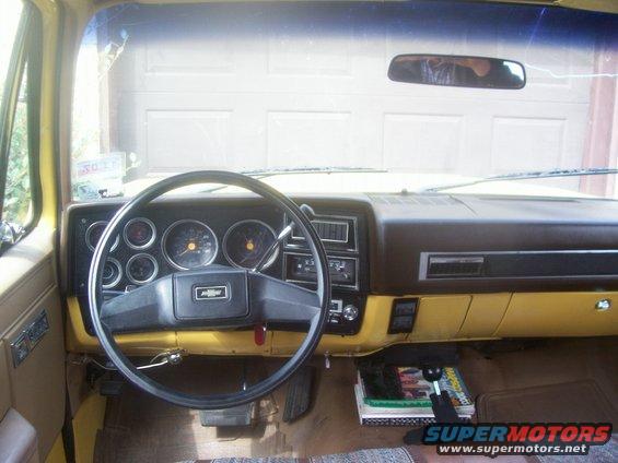 View of the dashboard AFTER I removed the brushed aluminum trim piece over the instrument cluster.