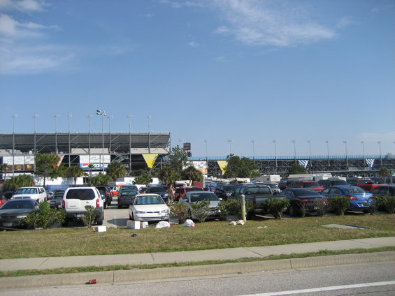 Parking lot with stadium in background