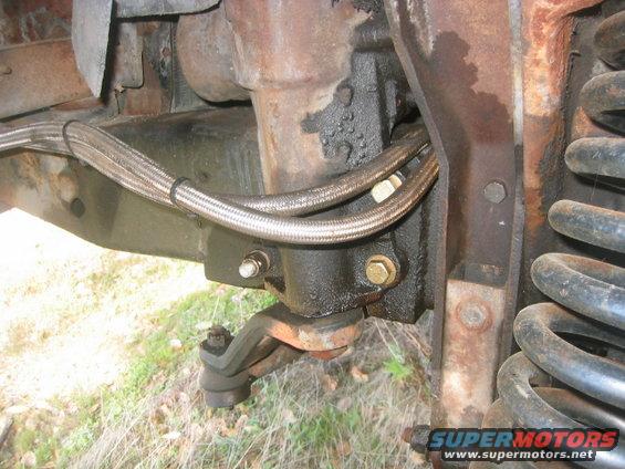 steering-003.jpg '73 F-100 I converted to power steering with '78 Bronco parts. 4" lift, dropped pitman arm and trac bar mount. Note angle iron welded to frame for box to mount to.