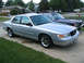 1999 Mercury Grand Marquis - Silver 1999 Mercury Grand Marquis with sunroof, parked on a paved driveway.