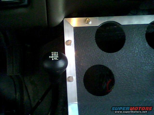 4x4 shifter with 2H, 4H, N, 4L markings and dashboard panel with circular cutouts