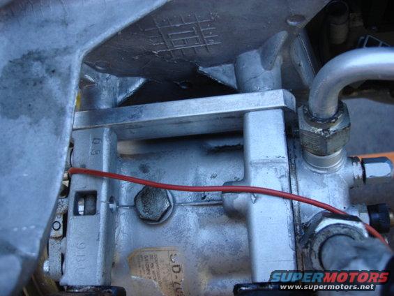 sagniawnew4.jpg as i was removing the AC compressor from the old mount i found they used a couple spacers. i found out this was due to the bolts having a long shoulder and the shoulder would hit the threads before the compressor was tight.