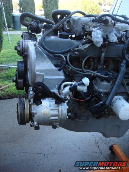 sagniawnew10.jpg here is a side view of the new mount and AC compressor installed.