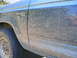 1990 Ford Bronco II - Mud splatters cover the side panel and fender of a Bronco II XLT.