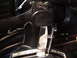1977 Ford Mustang - Close-up view of an aftermarket shifter, likely installed in a vehicle's interior.