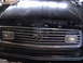 1977 Ford Mustang - The grille of a 1977 Ford Mustang features horizontal bars and a prominent running horse emblem.