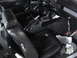 1977 Ford Mustang - The interior of a 1977 Ford Mustang features black vinyl seats and a dashboard with visible gauges.