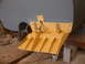 1978 Ford F-250 - A yellow trim tab is bolted to the gray hull of a boat, likely in a workshop setting.