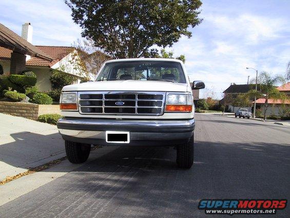 1992 Ford F-250 truck parked on residential street, front view
