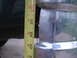 1974 Ford F-100 - A tape measure is held against a chrome bumper, indicating measurements between 29 and 31 inches.