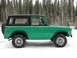 1975 Ford Bronco - Side view of a 1975 Ford Bronco in a snowy environment.