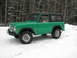 1975 Ford Bronco - A green 1975 Ford Bronco sits in the snow, ready for winter adventures.
