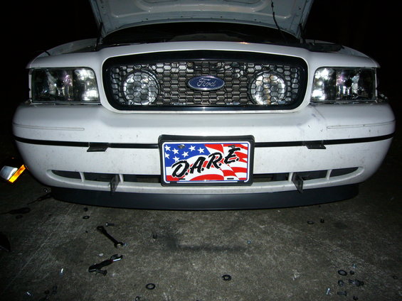 2000 Ford Crown Victoria front end with D.A.R.E. license plate and hood open