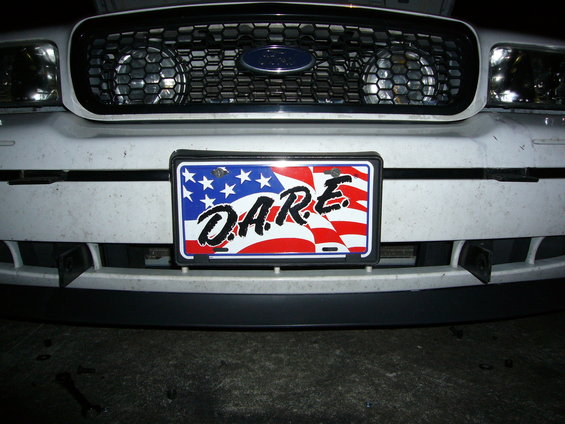 Front view of a 2000 Ford Crown Victoria with a D.A.R.E. license plate