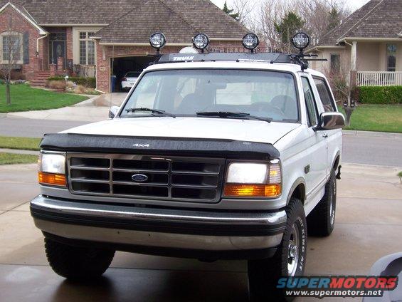 1994 Ford Bronco front view with roof-mounted lights and a bug deflector