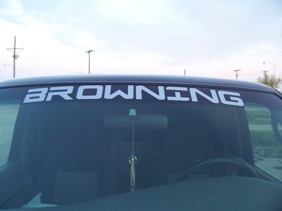 Windshield banner reads BROWNING. Interior view of a truck