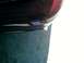 2004 Ford Crown Victoria - Close-up of a dark red car's rear bumper and exhaust pipe.