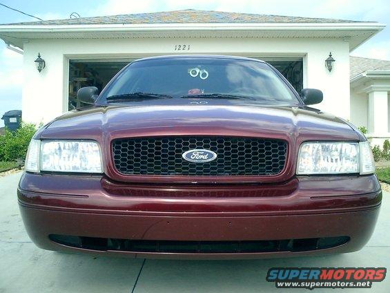 Maroon Ford Crown Victoria front view, parked in driveway