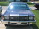 1999 Mercury Grand Marquis - Front view of a blue sedan, likely a 1979 Ford LTD, with a prominent chrome grille and square headlights.