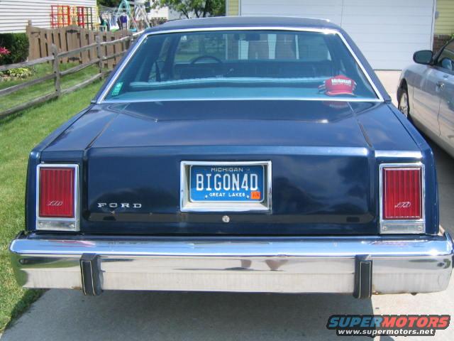 That says big on ford for all those who can't decipher
 it. Not big on 40's(40 oz.) as some like to tease. But that's not a bad idea.