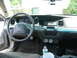 1999 Mercury Grand Marquis - The interior of a car shows the dashboard, steering wheel, and seats, with two gauges mounted below the radio.