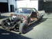 1979 Ford Ranchero - This 1979 Ford Ranchero is in a state of disrepair, with its engine compartment exposed and interior stripped.
