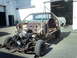 1979 Ford Ranchero - This vehicle body is suspended by straps from an overhead crane, revealing its chassis and engine.