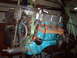 1979 Ford Ranchero - Engine block painted bright blue with chrome valve covers, suspended by green lifting straps.