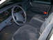 1999 Ford Crown Victoria - The interior of a 1999 Ford Crown Victoria, its dashboard, steering wheel, and cloth seats.