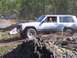 1989 Ford Bronco - A Jeep Cherokee navigates a muddy off-road track during an event in 2007.