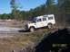 1989 Ford Bronco - A white Land Rover Defender 110 navigates a challenging off-road course during an event on March 17, 2007.