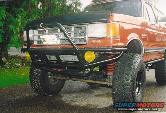 1987 Ford Bronco with custom front bumper and large tires