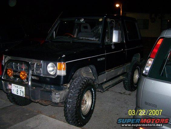 my pajero in the drive way with the new 33's  and a 3 inch body lift passenger side of the truck
