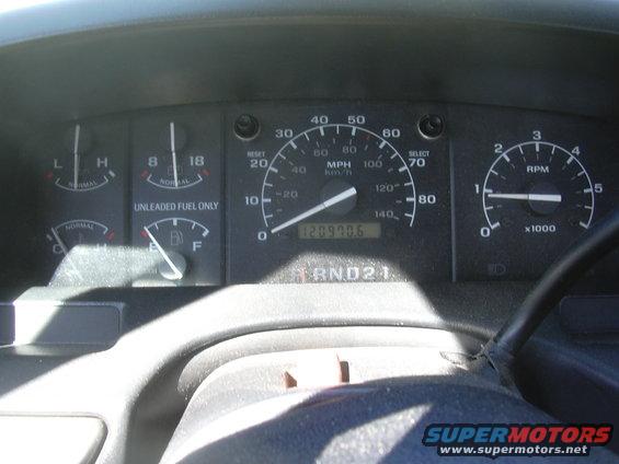Dashboard gauges showing fuel, temperature, speed, RPM, and odometer reading 120970.6
