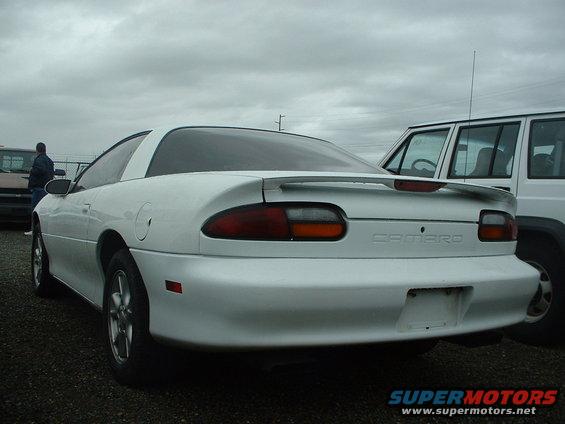 White Chevrolet Camaro rear view, with a spoiler and visible "CAMARO" badging