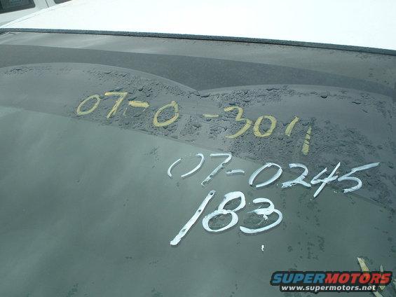 Windshield has handwritten numbers: 07-0-3011, 07-0245, and 183. Supermotors.net logo at bottom right