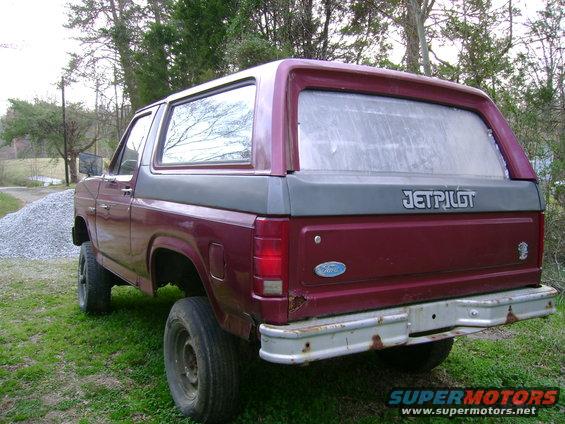 Maroon and grey 1989 Ford Bronco rear view with Jetpilot decal