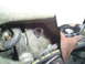 1995 Ford Taurus - Close-up view of hoses and pipes within a vehicle's engine bay.