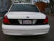 1999 Ford Crown Victoria - Rear view of a 1999 Ford Crown Victoria showing the taillights and license plate.