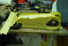 1993 Ford Bronco - A foam part, possibly an armrest, is clamped to a workbench with other tools and supplies visible.